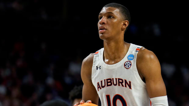 Mar 20, 2022; Greenville, SC, USA; Auburn Tigers forward Jabari Smith (10) attempts a free throw against the Miami (Fl) Hurricanes in the first half during the second round of the 2022 NCAA Tournament at Bon Secours Wellness Arena. Mandatory Credit: Jim Dedmon-USA TODAY Sports